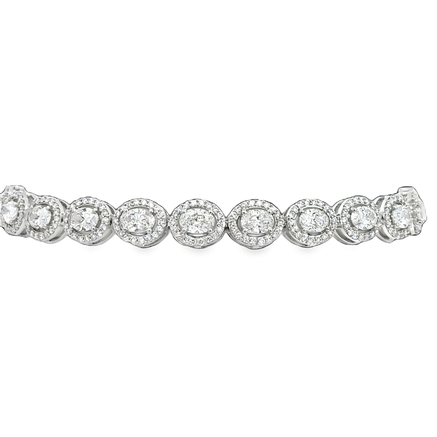 Lady's White 14 Karat Tennis Bracelet With 396 = 6.00Tw Round G/H Si2 Diamonds And 22 = 1.00Tw Oval G/H Si2 Diamonds