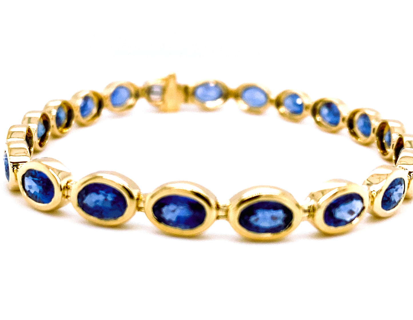 Lady's Yellow 14 Karat Tennis Bracelet Length 7 21 = 10.70tw Oval Sapphires