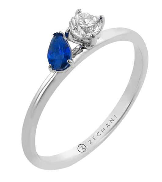 Lady's White 14 Karat Prong Fashion Ring Size 6.5 With One = 0.23Ct Round G Vs1 Diamond And One = 0.25Ct Pear Sapphire