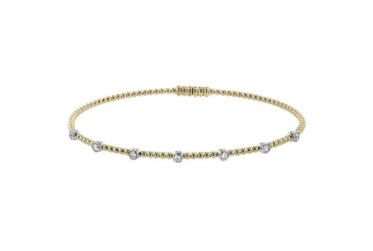 Lady's Two-Tone 18 Karat Bangle Bracelet With 7 = 0.24Tw Round G Vs1 Diamonds