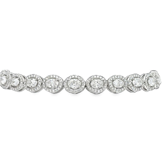 Lady's White 14 Karat Tennis Bracelet With 396 = 6.00Tw Round G/H Si2 Diamonds And 22 = 1.00Tw Oval G/H Si2 Diamonds