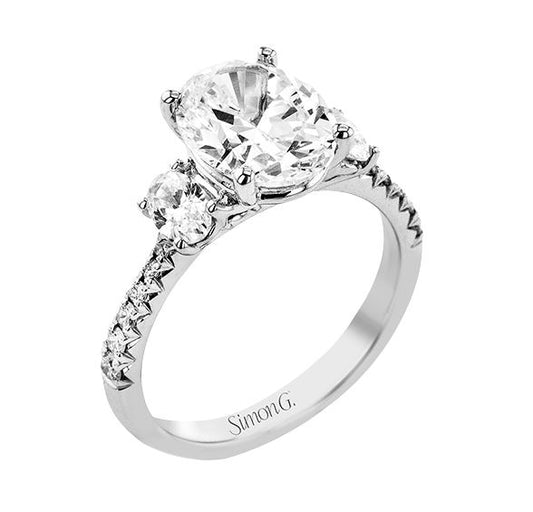 Lady's White 18 Karat 3 Stone Engagement Ring Size 6.5 With 0.16Tw Round G/H Si2 Diamonds And 0.49Tw Oval G/H Si2 Diamonds