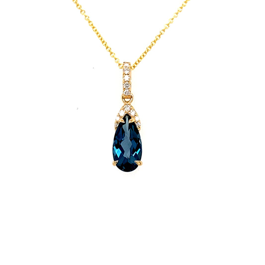Lady's Yellow 18 Karat Drop Pendants With One = 1.99Ct Pear Blue Topaz And 12 = 0.13Tw Round H Si1 Diamonds