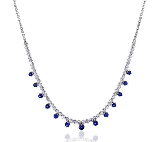 Lady's White 18 Karat Station Necklace Length 18 With = 1.17Twt Round Sapphires And 54 = 0.97Twt Round G Vs1 Diamonds